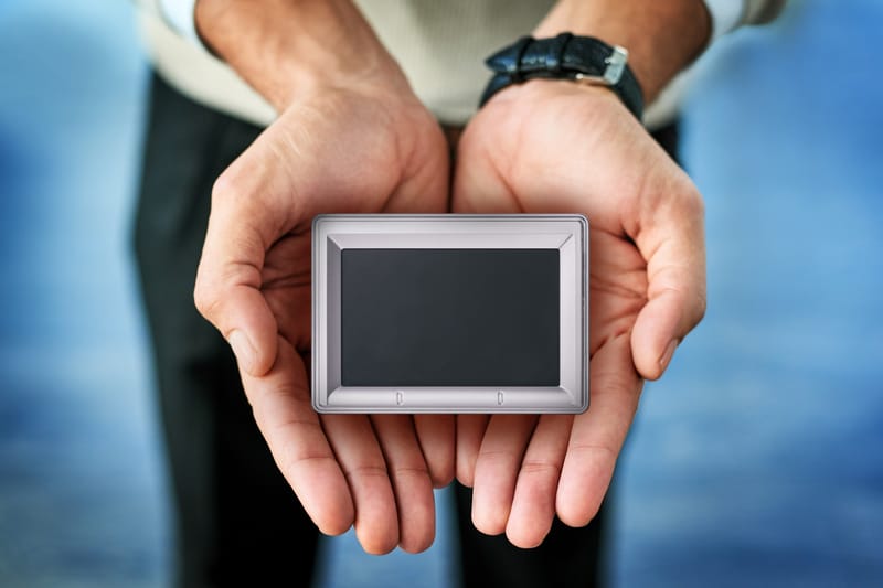 Five-0 fingerprint scanner resting in open hands