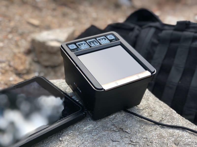 Kojak deployed outdoors on a rugged field kit with a tablet