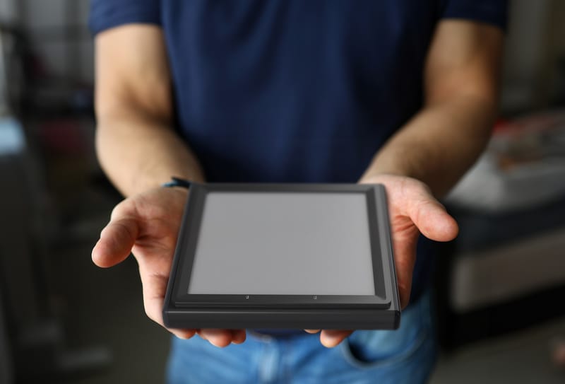 Person holding the Mannix palm scanner in both hands