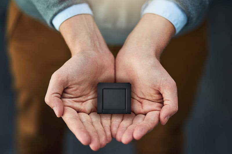 Sherlock fingerprint scanner resting in open hands